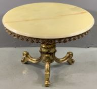 ONYX CIRCULAR TOPPED COFFEE TABLE on a brass pedestal support, 47 x 70cms