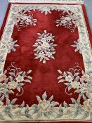 WASHED CHINESE RUG, red ground, 183 x 122cms