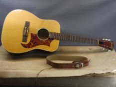BOXED RANCHER ACOUSTIC GUITAR and a leather support strap, 104cms L the guitar