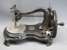 VINTAGE JONES COMPANY HAND CRANK SEWING MACHINE with applied decorative plaques and stamps as
