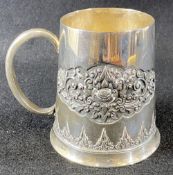 CONTINENTAL 800 STAMPED SILVER TANKARD - Indonesia with a continual floral band in relief, 12cms
