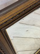 A LARGE MIRROR - wooden framed with bevel glass, 92 x 116cms