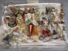VENETIAN STYLE GLASS SCENT BOTTLES and other similar cabinet ware, a colourful and delicate