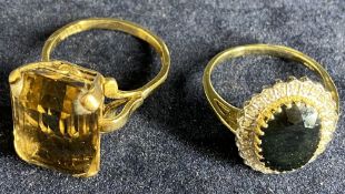 9CT GOLD DRESS RINGS (2) - one oblong smoky quartz, 10grms gross, size V, and the other oval