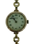 ROLEX 9CT GOLD CASED LADY'S VINTAGE WRISTWATCH with integral strap, the dial set with Arabic