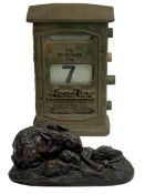 AEROFLEX CAST IRON DESKTOP CALENDAR and a composition bronze effect model of a rabbit with her