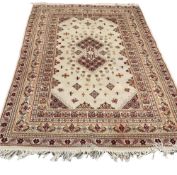 DECORATIVE WOOLLEN RUG with tasselled ends and multiple bordered pattern, 300 x 197cms