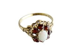 DRESS RING - centre opal and garnet cluster, size R, 2.4grms (one missing garnet)