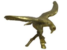 LARGE BRASS ORNAMENTAL EAGLE - modelled with open wings perched on a branch, 51cms overall H,