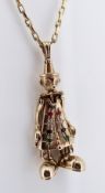 9CT GOLD CLOWN PENDANT set with multi-coloured semi-precious stones on 9ct gold chain, 29.5cms