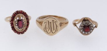 THREE 9CT GOLD RINGS comprising engraved signet ring and two 9ct gold semi-precious cluster rings,