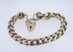 9CT GOLD HEAVY FLAT LINK BRACELET, having heart shaped padlock, 31.4gms Provenance: deceased