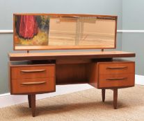 VICTOR. B. WILKINS FOR G-PLAN: Teak 'Fresco' dressing table, with mirror back, 'hovering' top over 4