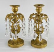 PAIR EMPIRE STYLE GILT BRONZE CANDLE LUSTRES, fleur-de-lis collars suspending cut glass drops,