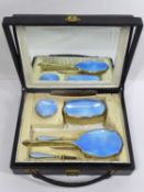 SILVER & GUILLOCHE ENAMEL SEVEN PIECE VANITY TRAVEL SET, Birmingham 1927, in original fitted case,