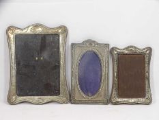 THREE SILVER REGENCY STYLE PHOTOGRAPH FRAMES, Chester hallmark the largest, 24 x 16.5cms and two