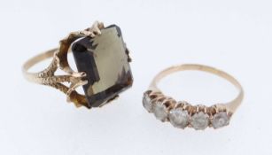 TWO GOLD RINGS comprising yellow metal five stone ring set with five white gem stones and