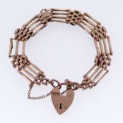 9CT GOLD FOUR BAR GATE BRACELET, having heart shaped padlock, 16.3gms Provenance: private collection