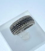 14K WHITE GOLD DIAMOND & SAPPHIRE SEVEN ROW RING, ring size N, 8.0gms, in heart shaped ring box