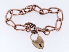 9CT ROSE GOLD CURB LINK BRACELET, having yellow gold heart shaped padlock, 24.5gms Provenance: