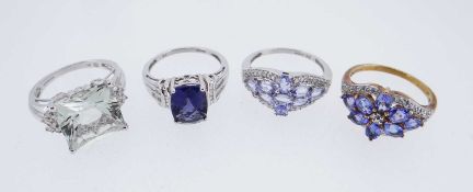 FOUR 9K GOLD DRESS RINGS, of various design set with diamond chips and semi-precious stones, 14.5gms