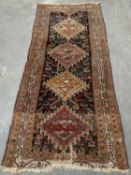 EASTERN CARPET RUNNER, multi-coloured with repeating central diamond pattern, multi bordered edge