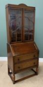 POLISHED OAK BUREAU BOOKCASE, the upper section with twin glazed doors having cloud effect