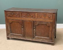 ANTIQUE OAK DRESSER BASE having three drawers over two fielded panel cupboard doors and central