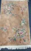HEAVY GAUGE FINE QUALITY WASHED WOOLLEN CHINESE RUG - peach ground with typical floral motifs and