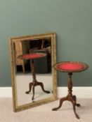 BEVELLED GLASS WALL MIRROR in a gilt frame, 100 x 71cms and a tooled top tripod base wine table,