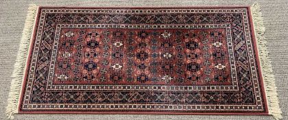 ROYAL KESHAN RUG - red ground with multi-border and Aztec/geometric design, 83 x 160cms
