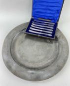 ANTIQUE PEWTER CHARGER, 42cm diam. and a boxed set of silver handled fruit eaters (2) Comments: