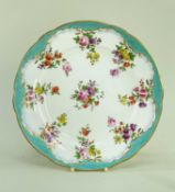 NANTGARW PORCELAIN PLATE circa 1818-1820, slightly wavy border, having a solid gilt rim, turquoise