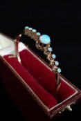 14K GOLD OPAL SET BRACELET, the central circular opal (7mm diameter) flanked by a further eight