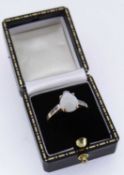 9CT GOLD OPAL RING set with six diamonds to the shoulders, ring size R / S, 2.6gms Provenance: