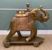 LARGE SHEET BRASS & COPPER CUPBOARD CARVED ELEPHANT, on wheeled base, 115cms high x 48cms wide x