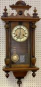 CIRCA 1900 VIENNA TYPE WALNUT CASED WALL CLOCK having Roman numerals set against enamel, before a