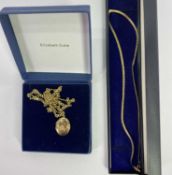 TWO 9CT GOLD NECKLACES including a flatlink example with central heart and the words 