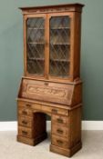 ANTIQUE BUREAU BOOKCASE, the top with twin leaded glass doors and carved inscription 