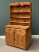 MODERN PINE DRESSER with three shelf shaped top rack and three drawers over two cupboard doors,