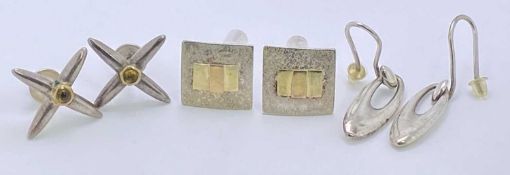 SILVER/WHITE METAL EARRINGS, THREE PAIRS - 1. a pair of star shaped, each with a centre amber