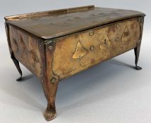 'ARTS & CRAFTS' COPPER CASKET - having a hinged lid and riveted corner supports on stylised feet,