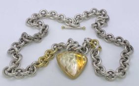 A 925 SILVER LINK BRACELET - with triangular domed glass pendant with 'wavey' base to the pendant