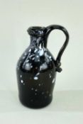 SMALL NAILSEA GLASS JUG, c.1800, of bottle form with rounded shoulders and applied scroll handle,