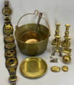BRASSWARE - a swing handled jam pan, an iron handled saucepan, two pairs of candlesticks, horse