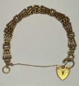 9CT GOLD FANCY GATELINK BRACELET with chase decorated padlock clasp and safety chain, 16cms L