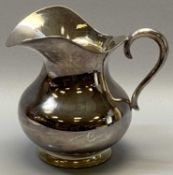 ITALIAN PLANISHED UPPER WATER JUG - stamped '800' to the base, bulbous body with flared rim and