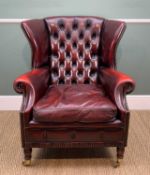 VICTORIAN-STYLE RED LEATHER UPHOLSTERED WING-BACK ARMCHAIR, close nailed, a loose cushion,