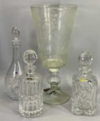 ETCHED GLASS GOBLET SHAPED VASE and three crystal glass decanters with stoppers, the vase with