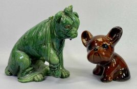 BRETBY & DENBY POTTERY DOG FIGURINES - the Bretby example in a green majolica type glaze modelled